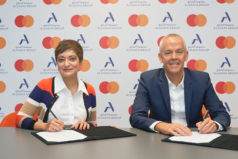 original  Amnah Ajmal (left) and John Hadden (right) at the signing ceremony (Photo: AETOSWire)