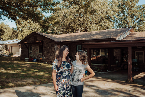 A homeowner in Batesville, Arkansas, seen here with her daughter, is the proud owner of a storm-resistant roof funded by the Federal Home Loan Bank of Dallas through Simmons Bank that is fortified to withstand damage from wind, hail and thunderstorms. (Photo: Business Wire)