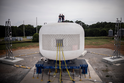 Sierra Space team members Shawn Buckley (L) and Gerard Valle (R) stand high atop the company’s second full-scale test article on June 18, 2024, at NASA’s Marshall Space Flight Center in Huntsville, Alabama. (Photo Credit: Andrew Hughes/Sierra Space)