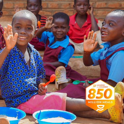 Nu Skin celebrates its milestone of 850 million meals purchased and donated in its fight against child malnutrition. (Photo: Business Wire)