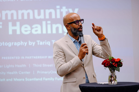 Photographer Tariq Tarey introduces Community of Healing: Portraits from the Whole-Person Specialty Care Movement at its opening night July 17th, 2024. (Photo: Megan Barnard)