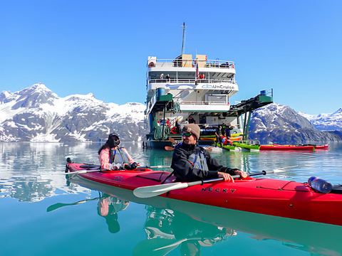 Guests enjoy a kayak ride on an UnCruise Adventure in Alaska. (Photo: Business Wire)