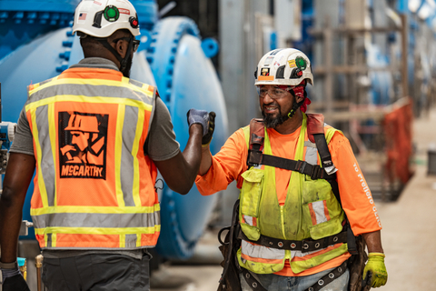 Two McCarthy employees on the jobsite (Photo: Business Wire)