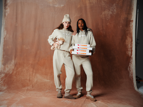 Dunkin' releases a limited-edition Dunkalatte-inspired merch collection, featuring a Dunkalatte Beanie, Dunkalatte Hooded Sweatshirt and Matching Sweatpants – all in the creamy, light brown hue of the perfect Dunkalatte. Plus, a magical Coffee Milk Cow Plush Toy. (Photo: Business Wire)