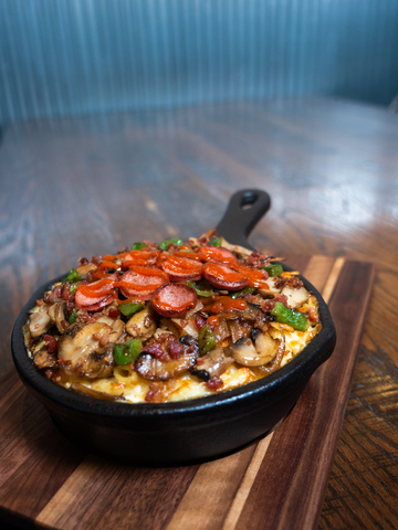 Hangover Mac N' Cheese at MACS Macaroni and Cheese Shop at Kalahari Resorts in Sandusky, Ohio features pepper jack and mozzarella cheeses, hash browns, bacon, hot dogs, green peppers, onions, mushrooms, and sriracha. (Photo: Business Wire)