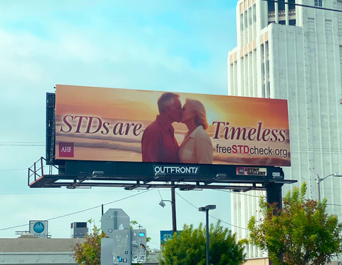 AHF is rolling out a new national outdoor advertising campaign reminding older adults that “STDs are Timeless.” The ads feature a variety of older couples kissing on the beach with an idyllic golden sunset behind them. The “Timeless” headline is accompanied by the URL for AHF’s freeSTDcheck.org website. (Photo: AHF)