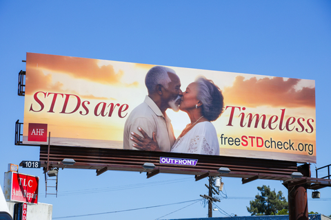 AHF is rolling out a new national outdoor advertising campaign reminding older adults that “STDs are Timeless.” The ads feature a variety of older couples kissing on the beach with an idyllic golden sunset behind them. The “Timeless” headline is accompanied by the URL for AHF’s freeSTDcheck.org website. (Photo: AHF)