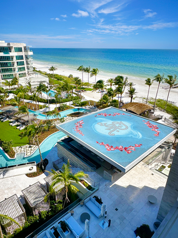 The expansive 60-foot by 60-foot rooftop pool mosaic, featuring over 750,000 handmade tiles, incorporates Corral’s signature large-format custom handmade Smalti mosaic glass chunks, accented with 24kt white and yellow gold inlays within the Jacaranda flowers. (Photo: Business Wire)