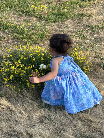 Three-year-old Nanaimo girl, who has Short Bowel Syndrome, enjoys picking flowers—a simple joy made possible by a life-changing medication not covered in BC. (Photo: Business Wire)