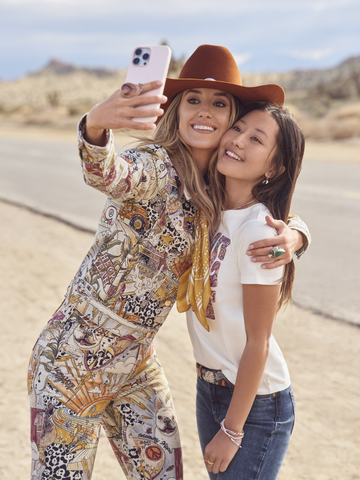 Several pieces, including printed tees and storyteller trucker jackets and flares are available in girls’ sizes, sharing the Lainey Wilson look with the next generation of rising stars. (Photo: Business Wire)