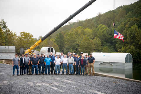 The Element U.S. Space & Defense team in Rustburg, VA proudly stands next to the $3M barge that will help them to continue supporting the U.S. Navy in protecting our sailors at sea. (Photo: Business Wire)