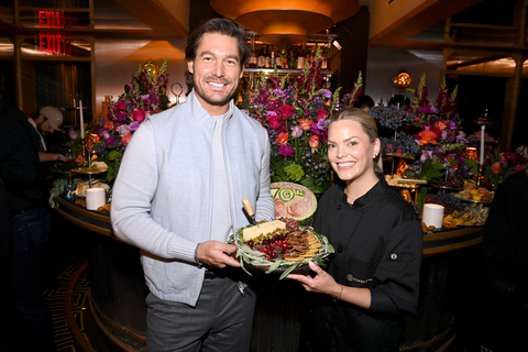 original Craig Conover and Lauren Clark, Culinary Manager at Lactalis Heritage Dairy, holding the Holiday Board in celebration of the Cracker Barrel Cheese 70th anniversary. (Photo: Business Wire)