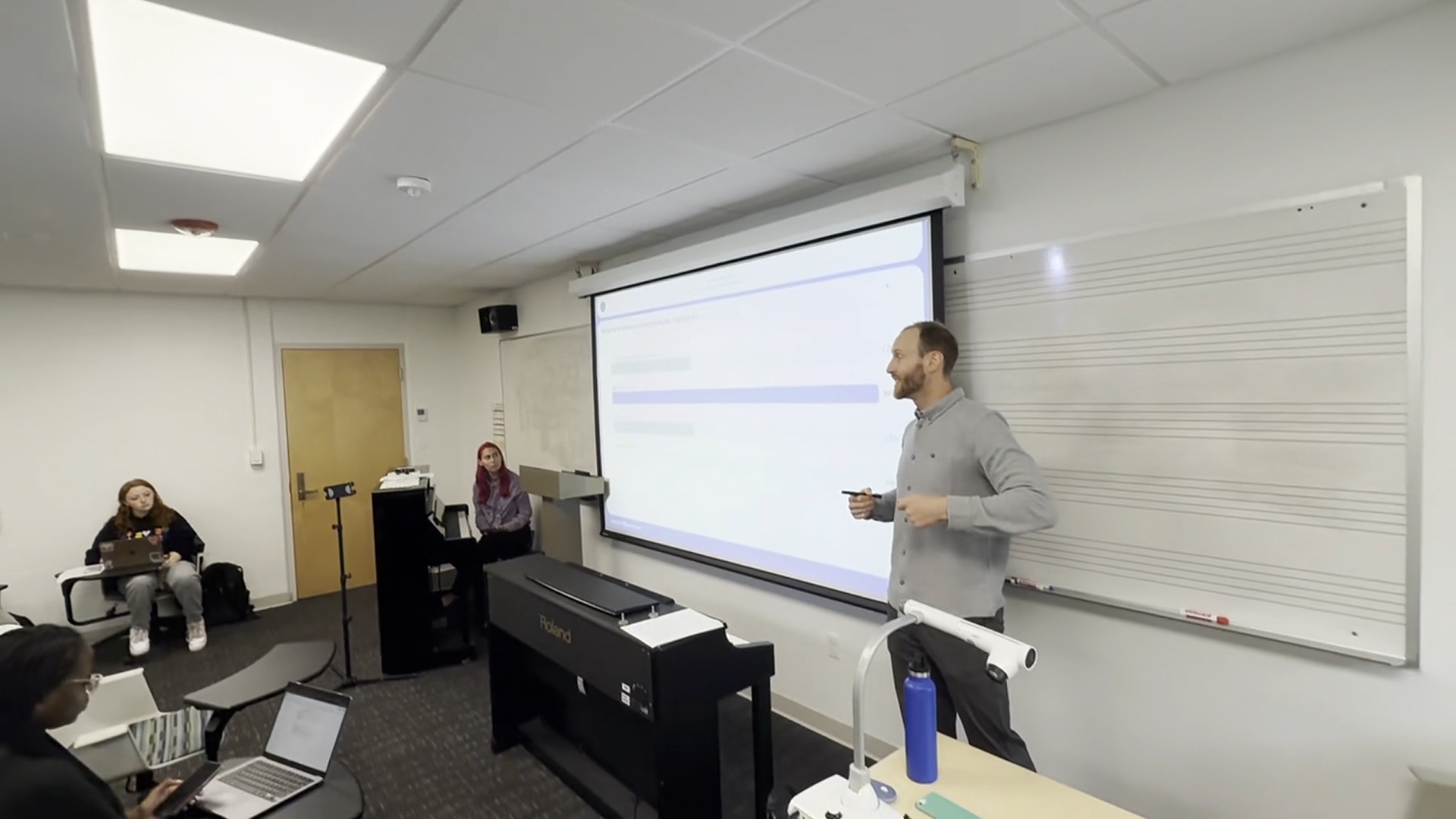 Roger Williams University Assistant Professor of Public Health P. Jacob Bueno de Mesquita, Ph.D teaching his class about the benefits of Lit Thinking's Far-UVC technology being used in his classroom.