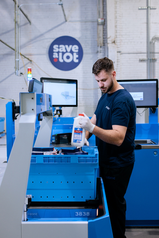 An employee at the Save A Lot micro fulfillment center in Brooklyn picks items for a customer order. One employee is able to pick four orders simultaneously. Photo credit: Dan Powell