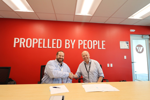 Sean Jones, Westinghouse’s Senior Director of Energy Systems Account Management & Procurement Execution, shakes hands with Jari Anttila, Chief Operating Officer, Seaspan Shipyards, after signing the agreement. (Photo: Business Wire)