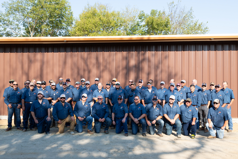 The crew from Cornerstone Building Brands, including members of the Mueller brand team, posing by the brand new, fully outfitted building. (Photo: Business Wire)