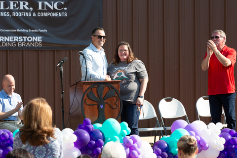 Matt Ackley, President, Shelter Solutions at Cornerstone Building Brands, delivers the keys to the new building to Bethany Black, Executive Director of the Women’s Crisis Services of LeFlore County. (Photo: Business Wire)