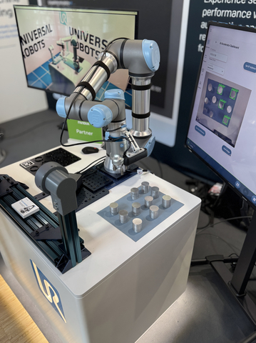 The AI Accelerator toolkit is enabled by Universal Robots' next-generation software platform PolyScope X powered by NVIDIA Isaac™ accelerated libraries and AI models. Depicted here from today's ROSCon exhibition 2024 is a demo of the AI Accelerator with a CNC machine tending application using a UR5e cobot. (Photo: Business Wire)