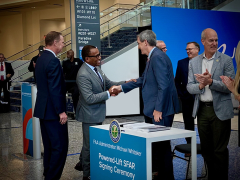 Former FAA Administrator and current Archer Chief Regulatory Affairs Officer, Billy Nolen, shakes hands with current FAA Administrator, Mike Whitaker, shortly after the final powered-lift SFAR is signed. (Photo: Business Wire)