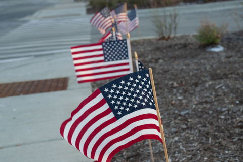 Five American Flags in the ground to honor Veterans Day (Photo: Business Wire)