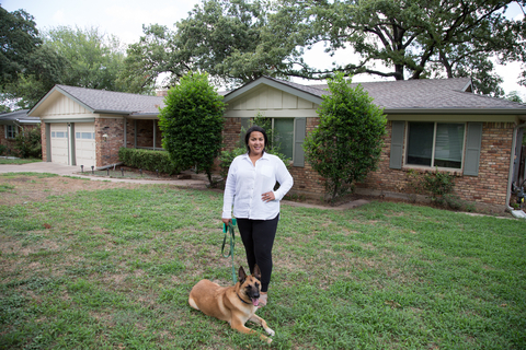 Retired Army Specialist in front of her home in Texas. (Photo: Business Wire)