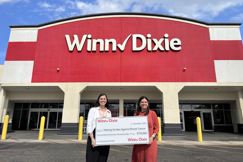 For 16 years, Winn-Dixie has proudly partnered with the American Cancer Society Making Strides Against Breast Cancer campaign. Jennifer Robertson, Regional Vice President for Winn-Dixie, (left) and Kate Kelley, Vice President, South Regional Development for the American Cancer Society, (right) stand together with the grocer's donation to strengthen community resources and support neighbors affected by breast cancer across the Southeast. (Photo: Business Wire)