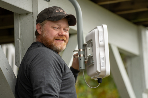 Alaska Communications technician, Travis, delivers broadband service to a customer’s home in Soldotna. Photo courtesy of Alaska Communications.