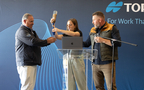 The water filtering system was demonstrated during the Wine To Water Filter Build event at the Topcon Technical Xperience. From left: Mike Gomes from Topcon, Mary Martha Prince and Tim Cox, Jr., from Wine To Water. (Photo: Business Wire)