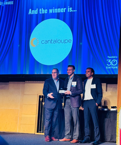 Ravi Venkatesan, CEO of Cantaloupe, Inc., along with Gaurav Singal, Chief Technology Officer, accept one of two awards recently presented to them by the Technology Association of Georgia. The awards recognized innovation and impact in Fintech. (Photo: Business Wire)