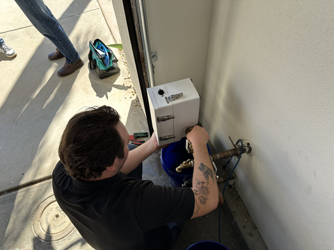 Owner of Trusty Plumbing, Dominic Ratajczak, installs new Namara Smart Water Control System into home. (Photo: Business Wire)