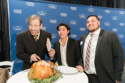 16th Annual NAC Thanksgiving Dinner - Ceremonial cutting of the turkey (Dr. Henry T. Nicholas, Marco Ramirez, Rudy Duarte) (Photo: Business Wire)