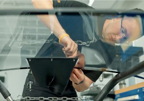 Stratasys has become the official and exclusive 3D printing partner for NASCAR. Here an engineer attaches a 3D printed duct used to keep drivers cool during races. (Photo: Business Wire)