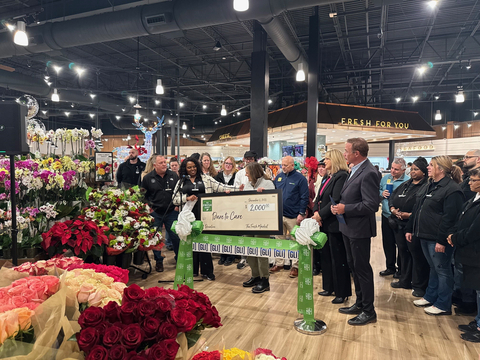 The Fresh Market presents check to Dare To Care Food Bank at the grand opening of their second Louisville location. (Photo: The Fresh Market)