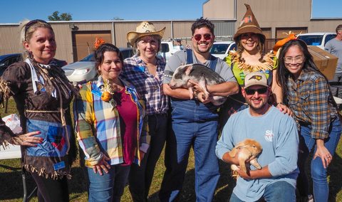 Local property management teams join the fun by dressing for the theme and cuddling a few furry guests. (Photo: Business Wire)