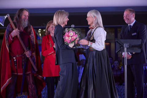 Pictured here, Karine Hagen, Viking Executive Vice President of Product, presented godmother of the Viking Vela, Ivana Elice with a bouquet of flowers during the naming ceremony. For more information, visit www.viking.com. (Photo: Business Wire)