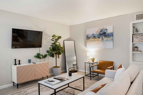 Living room in beautiful model unit at 600 Nottingham Apartments (Photo: Business Wire)