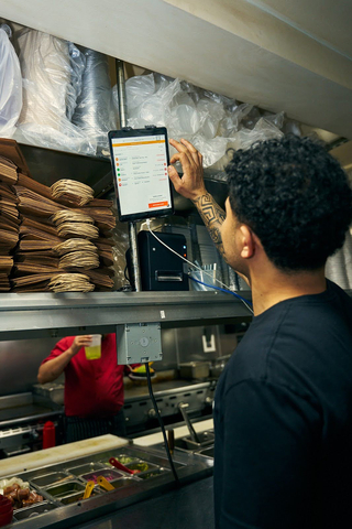 The Otter tablet being used inside Orbital Kitchens Manhattan location. (Photo: Business Wire)