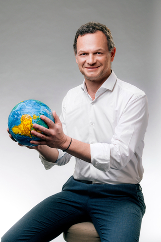 thumbnail Thierry Navarre, CEO of Cedo, pictured with a globe made from some of the 200,000 tons of recycled soft plastics that Cedo is now capable of processing each year. (Photo: Business Wire)