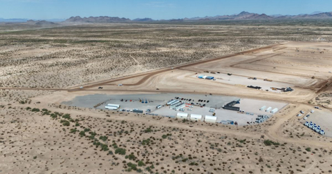 Aerial view of construction site preparation for one of Jones Power's Arizona utility-scale solar and BESS projects, showcasing early-stage civil work including laydown yards and access roads in the desert landscape. (Photo: Business Wire)