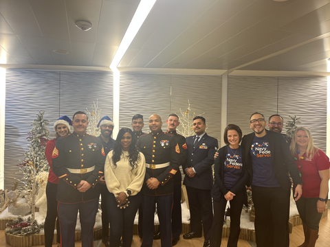 Navy Federal volunteers and Quantico Marines collect toys for families in need. (Photo: Business Wire)