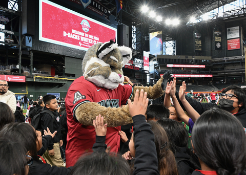 Arizona school children gather around the Arizona Diamondbacks® mascot at the 27th annual Arizona Diamondbacks Winter Classic celebration presented by University of Phoenix. The event took place on December 10, 2024, at Chase Field and provides local children with a day of celebration. (Photo: Business Wire)