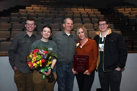 Niki Kigerl, Eaglecrest High School teacher and award recipient, poses with her family. Photo courtesy of Garo Productions.