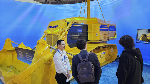 A Komatsu employee explains the company's vision for underwater construction of the future on Jan. 7 at CES 2025 in Las Vegas. (Photo: B	     
	     <img src=