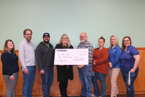 The KWIKOM marketing team presents the company's $2,000 donation to the Tri-Ko administration team. Pictured left to right: Nicole Page, KWIKOM Sales Manager; Trenton Travis, KWIKOM Director of Marketing; Devon Powell, Tri-Ko Director of Day Program Services; Sharron Robinson, Tri-Ko Director of Business & Finance; John Platt, Tri-Ko Executive Director; Kaitlin Shay, Tri-Ko Day Services Manager; Kenzie Prewitt, KWIKOM Marketing Specialist; Shirette Stockdall, KWIKOM Marketing Specialist. (Photo: Business Wire)