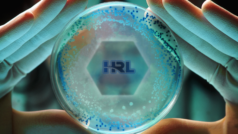 HRL Laboratories developed an innovative antimicrobial biphasic polymer coating designed to combat viruses and bacteria on surfaces while maintaining high durability standards in a recently published paper in the journal Langmuir. (Graphic: Business Wire)