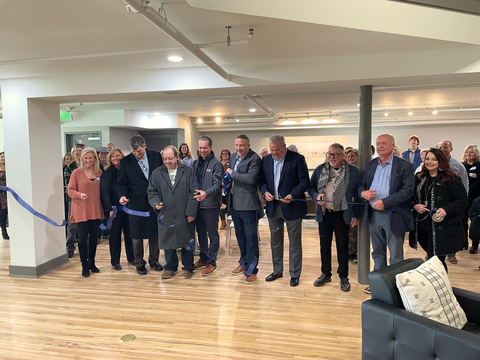 Partners gather for the ribbon cutting of Daugherty Lofts. (Photo: Business Wire)