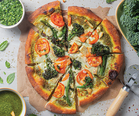 Broccolini Pesto Pizza - A delightful blend featuring Russo's signature pistachio basil pesto sauce, complemented by fresh broccolini, ripe Roma tomatoes, and succulent grilled chicken, all topped with mozzarella cheese and baked to perfection. (Photo: Business Wire)