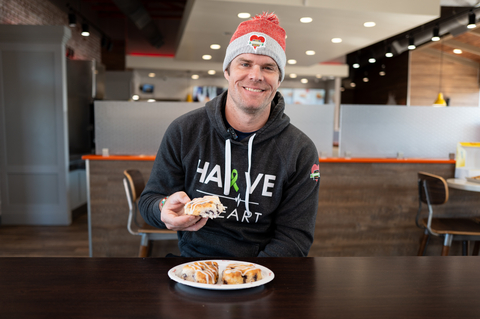 Greg Olsen enjoying a Heart-Shaped Bo-Berry Biscuit! (Photo: Business Wire)