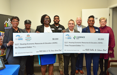 FHLB Dallas Community & Economic Development Product Manager Mark Loya (fourth from right) is accompanied by representatives from member financial institutions and Housing Economic Resources & Education (HERE), a nonprofit, to celebrate two Partnership Grant Program checks for homeownership education. (Photo: Business Wire)