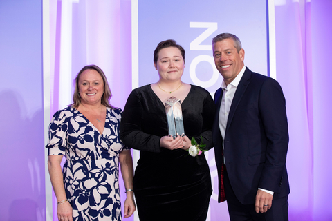 thumbnail Caitlin Drumel, a Registered Behavior Technician with Maxim Healthcare Services, is presented with the company's first National Behavioral Caregiver of the Year award. Pictured with Drumel is Maxim Healthcare Services' CEO, Jarrod DePriest, and Kellie Lanier, Maxim's Senior Vice President of Clinical Operations and Chief Nursing Officer.